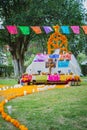 Day of the Dead, altar with flowers and food surrounded by trees and grass in Michoacan Mexico Royalty Free Stock Photo