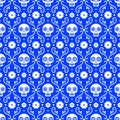Day of the dead seamless pattern with skulls and flowers on blue background. Traditional mexican Halloween design for Royalty Free Stock Photo