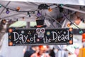 Day of the dead sign with sugar skull, at the Dia de Los Muertos celebrations