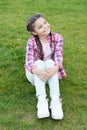 Day dreaming. Parks and outdoor. cheerful daydreamer. Spring nature. Summer picnic. Small school girl with trendy hair Royalty Free Stock Photo