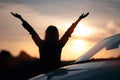 Silhouette of Happy Female Driver Next to her Car Royalty Free Stock Photo