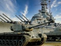 Day exterior view of Battleship Alabama and tank