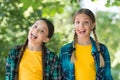 Day full of fun. carefree kids posing outdoor. Positive models. Casual hipsters outfit. portrait of happy sisters. funny Royalty Free Stock Photo