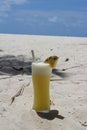 A day in the Maldives, a glass of freshly squeezed pineapple juice with white foam, an inserted straw and a piece of pineapple on Royalty Free Stock Photo