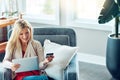 This day is about me and all my desires. a young woman holding her digital tablet in her hand and her credit card in the Royalty Free Stock Photo