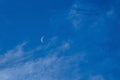 day moon against a blue sky with Cirrus Cumulus clouds Royalty Free Stock Photo