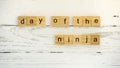 Day of the Ninja.words from wooden cubes with letters photo Royalty Free Stock Photo