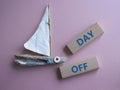Day off symbol. Concept word Day off on wooden blocks. Beautiful pink background. Business and Day off concept. Copy space Royalty Free Stock Photo