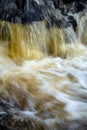 Tannins turn a waterfall amber in Colchester, Connecticut in autumn