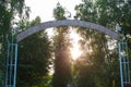 Day shot of an old weathered blue iron entrance gate with a Soviet hammer and sickle emblem on the top and communist ussr red Royalty Free Stock Photo