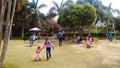 During the day, small children are playing in the park