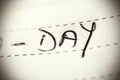 Day spelled on lined paper