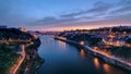 Day to Night view of the historic city of Porto, Portugal timelapse with the Dom Luiz bridge Royalty Free Stock Photo