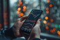 Day trader using trading app on smartphone checking stock market data Royalty Free Stock Photo