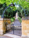 Day view entrance gates to typical Old English Church building Royalty Free Stock Photo