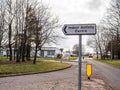 Day view Indoor Activity Centre directional road sign post on british road Royalty Free Stock Photo