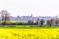 Day view of Northampton Town cityscape New Duston England, UK with canola field on foreground Royalty Free Stock Photo