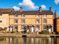 Day view old retro style building near boat canal in stoke bruerne england uk