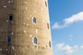 Day view stone tower windows over blue sky Royalty Free Stock Photo