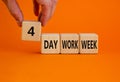 4 day work week symbol. Businessman holds the cube with words `4 day work week`. Beautiful orange background. Copy space. Busine Royalty Free Stock Photo