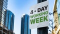 4 - Day Working Week on Worn Sign in Downtown city setting