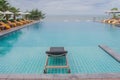 Daybed beside swimming pool.