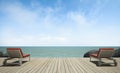 Daybed on wooden terrace at sea view