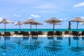 Daybeds at poolside with sea view