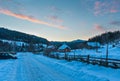 Daybreak sunrise morning winter mountain village snow covered st