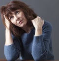 Daydreaming beautiful 50s woman looking contemplative Royalty Free Stock Photo