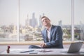 Daydreaming businessman in office Royalty Free Stock Photo