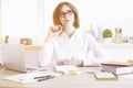Daydreaming businesswoman in office Royalty Free Stock Photo