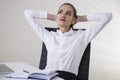 Daydreaming businesswoman in office Royalty Free Stock Photo