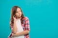 Daydreaming concept. Kid thoughtful face make decision. Child cute curly hair thinking. Girl casual look make hard Royalty Free Stock Photo