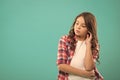 Daydreaming concept. Kid thoughtful face make decision. Child cute curly hair thinking. Girl casual look make hard Royalty Free Stock Photo