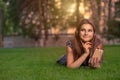 Daydreaming. Happy young cute student woman with smartphone headset on head listening to music looking away thoughtful pensive Royalty Free Stock Photo