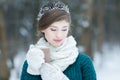 Daydreaming woman holding hot cocoa glass cup with marshmallows