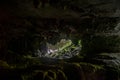 Daylight at the end of the tunnel in lang cave at Gunung Mulu national park. Sarawak Royalty Free Stock Photo