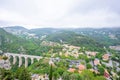 Daylight foggy view to Medieval stone arch bridge in the village Royalty Free Stock Photo