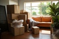 Daylight highlights packed furniture and boxes in an empty living space