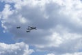 Daylight. large aircraft accompanied by combat vehicles. blue sky