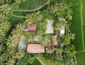Drone poto of a house in the middle of rice or a forest surrounded with several fish ponds and lots of trees and plants Royalty Free Stock Photo