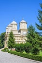 Daylight portrait far view to monastery and garden park Royalty Free Stock Photo