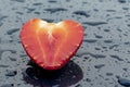 daylight. red strawberries on a blue background. Drops of water around the berry Royalty Free Stock Photo