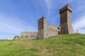 Daylight on Rocca of Radicofani fortress with plants on brick walls, Tuscany, Italy Royalty Free Stock Photo