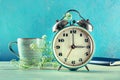 Daylight Saving Time concept, spring forward. A vintage alarm clock Royalty Free Stock Photo