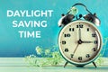 Daylight Saving Time concept, spring forward. A vintage alarm clock Royalty Free Stock Photo