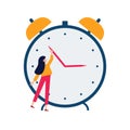 Daylight saving time concept. Young woman turn the hand of the clock. Turning to winter or summer time, alarm clock