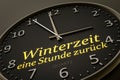 Daylight saving winter time one hour back modern black clock style Royalty Free Stock Photo