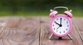 Daylight savings time, alarm clock on a wooden background, web banner